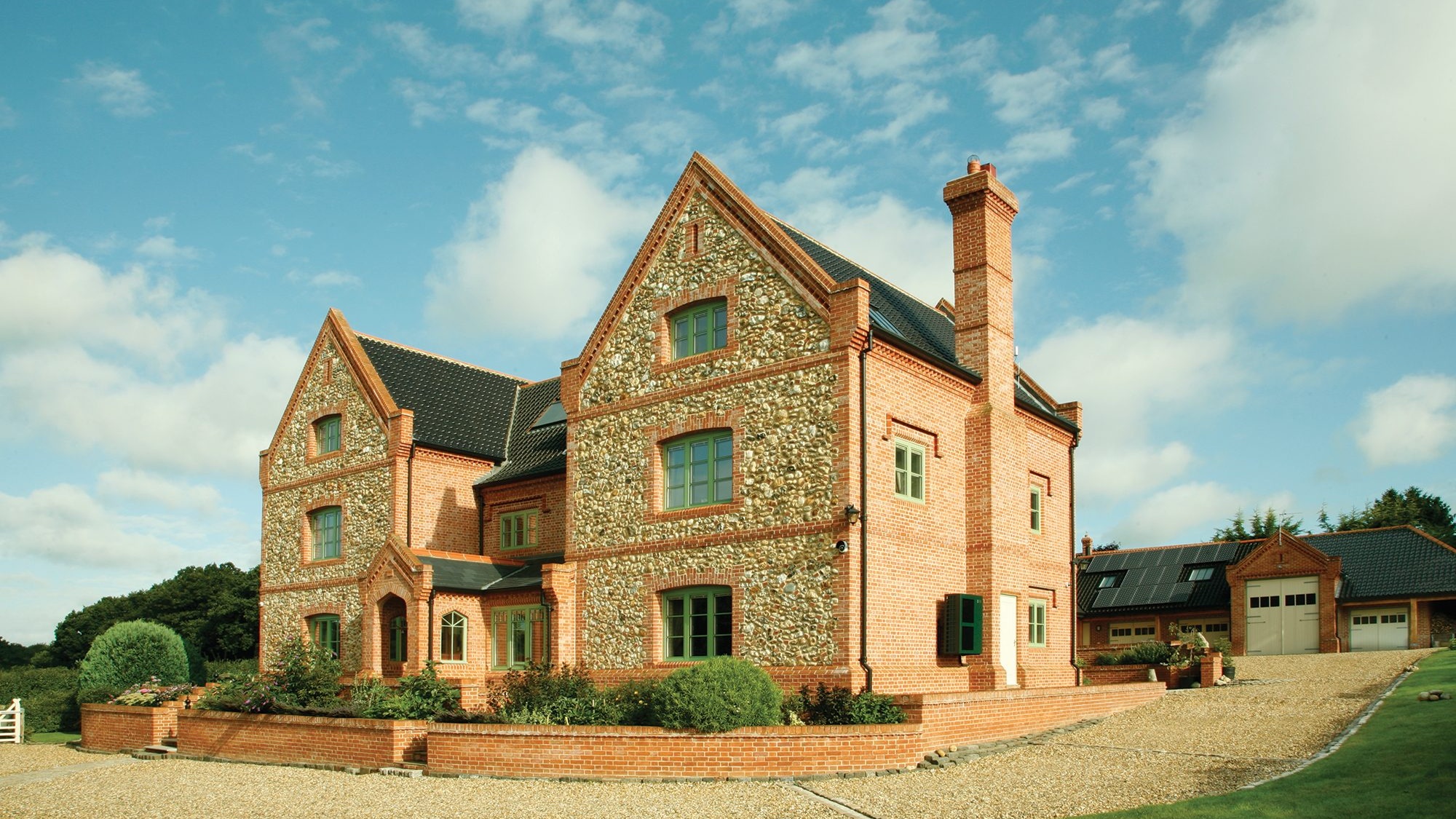 Traditional UK brick house with tiled roof